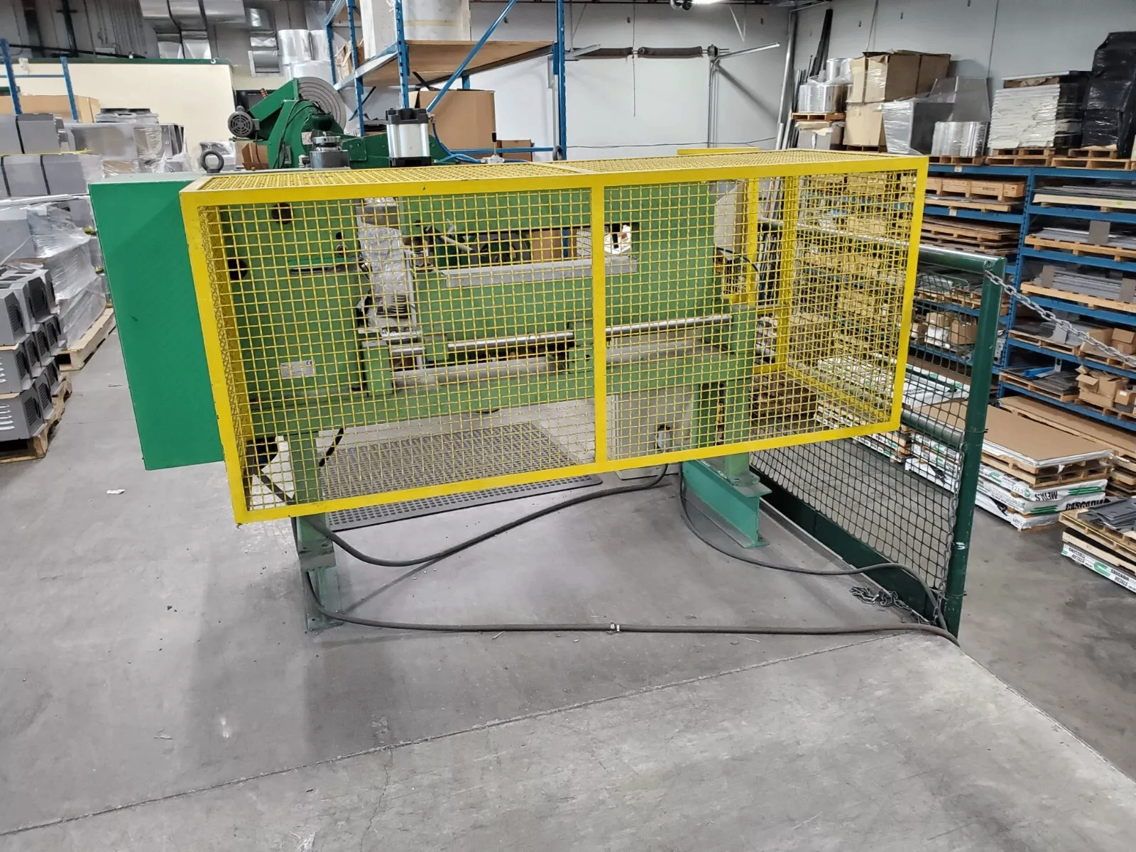 FortiFab forming equipment with yellow guarding in the Langley facility.